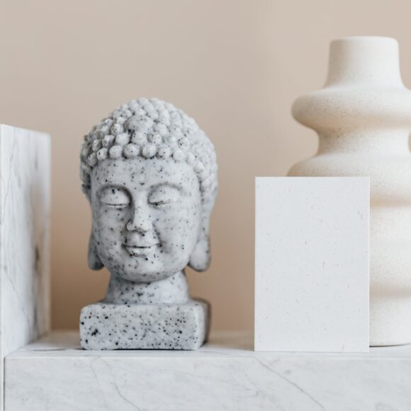 home decoration composition with buddha head and creatively shaped vase