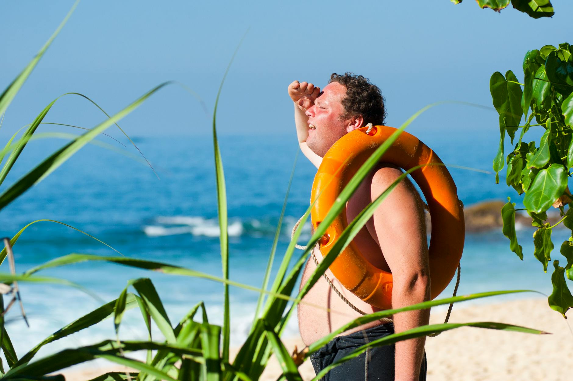 Orange Safety Ring on Man Shoulder Near Body of Water ｜可愛曼谷