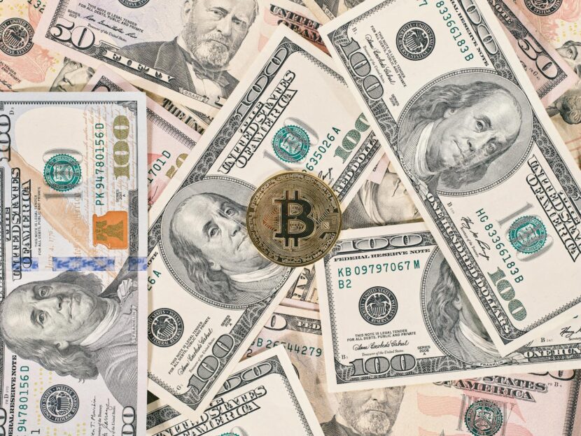 Bitcoin on American Dollar Banknote Close Up