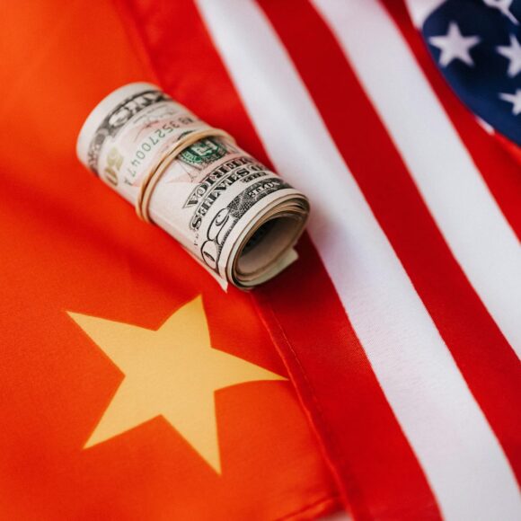 colorful flag of america and roll of paper bills