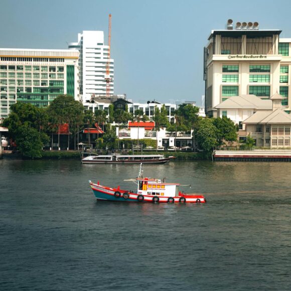 scenic view of chao phraya river with boat in bangkok